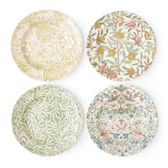 four plates with different designs on them