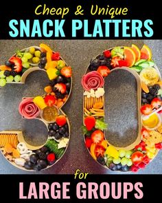 the number six made out of fruit and vegetables with text overlay that reads, cheap & unique snack platters for large groups