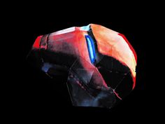 an iron man helmet is shown against a black background in this artistic photo, it appears to be made out of paper