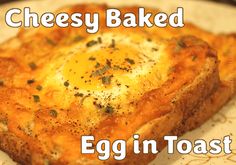 an egg in toast on a plate with the words cheesy baked