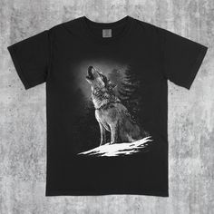 THE FIT The Howling Wolf Vintage 90s Graphic Tee captures the majestic scene of a wolf howling against a backdrop of wilderness, blending classic nature themes with retro style. This oversized unisex shirt is perfect for lovers of wildlife, outdoor adventures, and timeless animal graphics. - Runs true to size (Relaxed fit) - For oversized fit go one sizes up your normal size - Comfortable unisex fit - 100% fully cotton - Professional high quality print TYPES - Available in given colors and sizes Wolf Tshirt, Cute Wolf, Forest Wildlife, Forest And Wildlife, Tshirt Oversized, Howling Wolf, Wolf T Shirt, Wolf Howling, Vintage Graphic