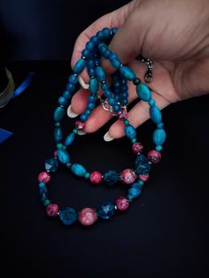 Beautiful handmade double strand choker necklace with various semi-precious stones. For the central part I used two different shapes of chrysocolla. To create the color contrast I used pink labradorite and quartz. The back part is made with agate beads. The necklace is very beautiful due to the contrast created between the blue and pink. The necklace is very elegant but at the same time has a touch of retro style, perfect for warm autumn evenings. The necklace is 47cm long and has a lobster clasp with a 7cm extension. Perfect for those who love boho and elegant style. All jewels are delivered in a decorated box, ready to be given as a gift to your loved one. How to take care of your jewellery: put on your beauty products (cosmetics, perfumes, ...) before wearing your precious jewel. Clean Blue Agate Jewelry With Colorful Beads, Blue Double Strand Natural Stones Jewelry, Blue Multi-strand Natural Stone Necklaces, Blue Multi-strand Gemstone Necklaces, Blue Multi-strand Natural Stone Necklace, Blue Gemstone Multi-strand Necklaces, Turquoise Agate Faceted Bead Necklaces, Blue Multi-strand Necklace With Natural Stones, Turquoise Agate Necklace With Faceted Beads