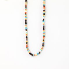 KAMPUNG PELANGI WOOD BEAD NECKLACE A classic and fun surf-style accessory! Our Kampung Pelangi Wood Bead Necklace is created using a scattered pattern of colourful wooden beads. Kampung Pelang, also known as The  Rainbow Village, is the inspiration behind this necklace. -Made with a wax polyester cord, dyed coconut wood beads and silver-plated zinc alloy disc. -Measures approx. 36cm with a 12cm sliding knot extension on either side - designed to fit all sizes! -Handmade in Bali. -Biodegradable or recyclable packaging.   -Matching bracelet and anklet available! OTHER INFORMATION All items are nicely packaged and ready to gift in biodegradable packaging. You can also upgrade your order at checkout to include a gift box and a handwritten note, all made from recycled materials. TURN AROUND TIM Orange Bohemian Hand-strung Beaded Necklace, Adjustable Multi-strand Wooden Beads Necklaces, Adjustable Yellow Wooden Beads Necklace, Bohemian Orange Hand-strung Necklace, Vintage Hand-strung Orange Beaded Necklace, Coconut Wood, Wood Bead Necklace, Sliding Knot, Adjustable Necklace