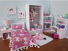 a dollhouse bedroom with pink furniture and accessories