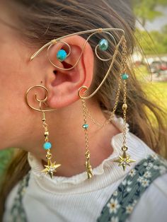 These Gold and Teal Zelda Inspired Ear Cuffs are made with pliable copper wire that is coated in aluminum so that they are lightweight and tarnish resistant. Because the wire is pliable this allows the ears to be perfectly bent and shaped to fit your ears! This makes these the ideal accessory to take any outfit to the next level, whether you are going to a renaissance faire, a rave/festival or just want to add some flare to an everyday outfit! Because these are made to order, there may be a slig Handmade Adjustable Fantasy Ear Cuff, Fantasy Adjustable Jewelry For Costume Party, Fantasy Gold Jewelry For Costume Party, Whimsical Adjustable Ear Cuff For Festivals, Handmade Gold Jewelry For Cosplay, Adjustable Gold Ear Cuff For Festivals, Gold Metal Ear Cuff For Festival, Adjustable Festival Ear Cuff, Adjustable Elven Jewelry For Festivals