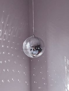 a mirror ball hanging from the ceiling in a room