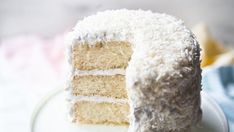 a white cake with coconut frosting on a plate