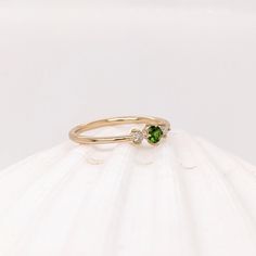 This beautiful ring features a 0.12 carat round Tsavorite gemstone with natural earth mined diamonds set in solid 14k gold. This ring makes a lovely January birthstone gift for your loved ones! This ring is made with solid 14K Gold and natural Earth mined SI / G-H diamonds. If you're interested in purchasing this setting with a different center stone please message us! Green Diamond Dainty Birthstone Ring, Dainty Green Diamond Birthstone Ring, May Birthstone Ring In Tsavorite, Tsavorite Birthstone Ring For May Birthstone Gift, Tsavorite Promise Ring For May Birthstone, Tsavorite Birthstone Ring For May, Tsavorite Fine Jewelry Birthstone Promise Ring, Tsavorite Birthstone Ring, Tsavorite Ring