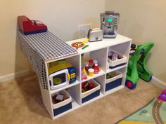 a child's playroom with toys and other items