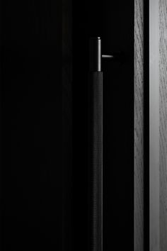 a black door with a metal handle on it