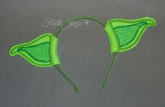 two green bras are shown on a gray background with the word faithtags written below them