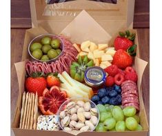 a box filled with assorted fruits and snacks