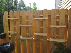 a wooden fence with some shelves on it