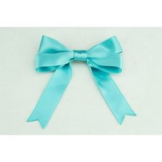 a blue ribbon with a large bow on the front and side of it, sitting on top of a white surface