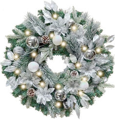 a christmas wreath with silver and white decorations