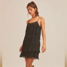 Tiered Fringe Detail Throughout With Scoop Neckline And Back Zip. Poly/Spandex Material Black Summer Dress With Fringe, Black Fringe Dresses For Summer, Black Fringe Summer Dress, Spring Black Fringe Dresses, Black Sleeveless Mini Dress With Fringe, Spring Black Mini Dress With Fringe, Black Dress With Pearls, Lace Cutout Dress, Lurex Dress