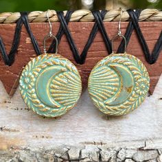 These hand made ceramic earrings are luminous, lightweight and unique- guaranteed to solicit compliments wherever they are worn! Hi, I am artist Duska Martovich: each piece I create is hand-crafted in my coastal Maine studio, then kiln-fired to a beautiful finish.  My designs are inspired by nature, history and love for the beauty in small things.  Each item is handmade; slight variations in size, color and detail are to be expected and make each a one of a kind art piece. *Sterling Silver Earwire *Earring Pendant Dimension:  1 1/16" = 27mm *Total Drop From Top of Earwire: 1 9/16" = 46mm *Weight of Individual Piece: 0.2 oz = 5.6 g Please note photos are enlarged to showcase detail, please check description and dimension photos when ordering. All items will arrive gift wrapped as pictured. Handmade Artisan Moon-shaped Jewelry, Handmade Moon Shaped Artistic Jewelry, Handmade Moon-shaped Artistic Jewelry, Handmade Artistic Moon-shaped Jewelry, Artisan Adjustable Polymer Clay Earrings, Adjustable Artisan Polymer Clay Earrings, Unique Handmade Ceramic Jewelry, Unique Handmade Moon-shaped Earrings, Handmade Earthy Round Earrings