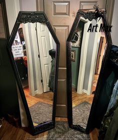 two mirrors sitting next to each other in front of a door