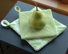 an apple sitting on top of a green cloth