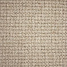 the texture of an upholstered carpet is shown in white and beige colors, as well as brown trim