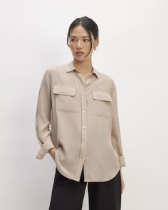 Just add pockets. About as effortless as a silk shirt gets, we took our best-selling Relaxed Silk Shirt silhouette and added pockets. The Washable Clean Silk Two-Pocket Relaxed Shirt features a traditional point collar, round hem, and two utility pockets. Plus, it’s made of our eco-conscious Clean Silk, for more beauty and less waste. Milled at a GOTS-certified facility, dyed at a bluesign®-certified dyehouse, and made at a LEED-certified factory, our Clean Silk is free of harmful chemicals Classic Collared Shirt With Side Pockets, Elegant Button-up Top With Flap Pockets, Versatile Button-up Blouse With Pockets, Classic Tops With Flap Pockets For Work, Elegant Collared Shirt With Pockets, Relaxed Fit Blouse With Pockets And Camp Collar, Collared Blouse With Pockets For Workwear, Relaxed Fit Blouse With Pockets And Lapel Collar, Relaxed Fit Blouse With Lapel Collar And Pockets