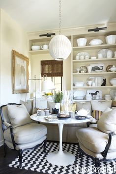 a living room filled with furniture and plates