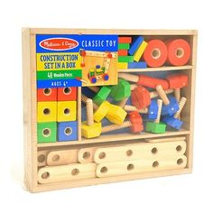 a wooden box filled with lots of toys