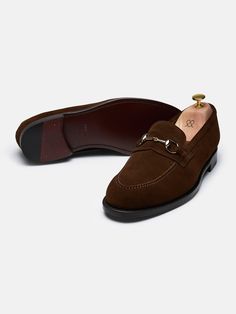 The Horsebit Loafer is our humble homage to the iconic model of Gucci that was first introduced to the market in the 1950s. It's crafted on the same last as our other penny loafers and finished with a horsebit ornament in a soft golden colour, adding an edge to an otherwise under-the-radar shoe. The result is a timeless staple that works with everything from denim to fine tailoring.    Fits large in size  We recommend selecting half a size down from what you usually wear in lace-up shoes. Please Classic Loafers With Horsebit Detail, Classic Loafers With Horsebit Detail For Galas, Golden Colour, Loafer Sneakers, Shoe Tree, Tassel Loafers, Driving Shoes, Suede Sneakers, Monk Strap