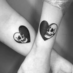 two skull tattoos on their wrists, one is in the shape of a heart