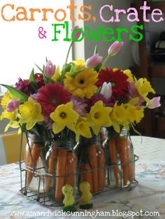 carrots and flowers are arranged in mason jars on a table with the words carrots, crate & flowers