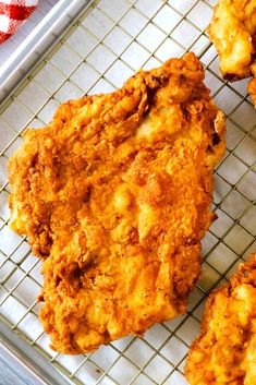 some fried food is sitting on a cooling rack