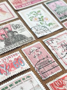 many different colored stamps on a table