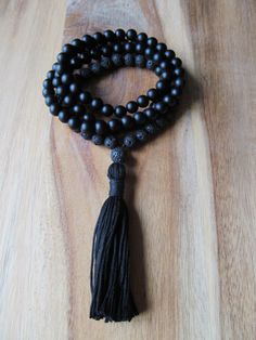 "108 Bead Matte Black Onyx and Black Lava Bead Mala This traditional 108 bead mala features a stunning combination of matte black onyx beads and black lava beads. It is finished off with a hand tied matching black tassel. Excellent for meditation or to wear as a beautiful long necklace. Materials: 8mm Matte Black Onyx Beads 8mm Black Lava Beads Black Knotting Cord Cotton Tassel Size info: 108 bead mala plus guru bead measures approximately 35 inches in circumference with a 3\" tassel. * All jewe