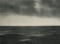 a black and white photo of the ocean under a cloudy sky with an airplane flying over it