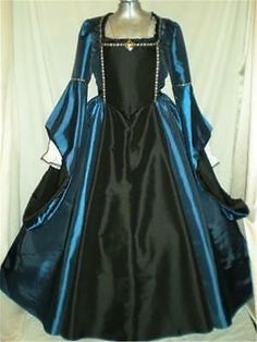 The entire dress with the exception of the front bodice, sleeve linings and front skirt is made of blue taffeta. And the front bodice, sleeve linings and front skirt are made of black taffeta. The hat is made of black taffeta with a small brim and blue feather. Elegant Fitted Blue Medieval Dress, Elegant Blue Medieval Dress, Fitted Gothic Medieval Dress In Blue, Fitted Blue Gothic Medieval Dress, Blue Fitted Gothic Medieval Dress, Medieval Blue Dress With Historical Design, Elegant Long Sleeve Medieval Dress For Fancy Dress, Blue Medieval Dress With Historical Design, Blue Dress With Historical Design And Fitted Bodice