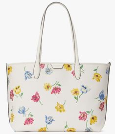 Kate Spade Tulip Toss Sutton Tote  Ivory Printed Coated Canvas; Color Code: cream multi (250) New with Tags; Authenticity Guaranteed! KB293 / Retail $298 Product description you know this tote holds your everyday stuff like a wallet, keys, phone, sunglasses. it also holds: two red lipsticks, $6 in change, 11 crumpled receipts, an avocado… DETAILS 11"h x 14"w x 6.25"d Handle drop: 14" Printed textured PVC with PU trim Faille lining Foil embossed logo Tote with open top and magnetic snap closure Interior zip pocket Interior slip pocket Fits current iPhone, iPad, A4 binder, 13" laptop dust bag not included Imported Style No. KB293 . . . v.11 BUY WITH CONFIDENCE: · Everything we sell is BRAND NEW & AUTHENTIC and purchased at CalvinKlein.com, Calvin Klein outlet, Coach.com, Coach outlet, Fossil Tory Burch Outlet, Cream Purse, Kate Spade Outlet, Michael Kors Outlet, Coach Outlet, Large Tote Bag, Open Top, Color Code, Embossed Logo