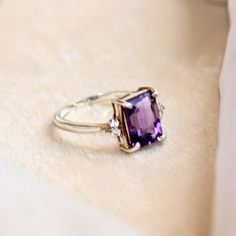 Natural Emerald Cut Amethyst Ring/925 Sterling Silver Ring For Women/Statement Ring/Gift For Girlfriend/Purple Stone Ring/Silver Amethyst  This elegant ring features a natural amethyst gemstone, expertly cut into a sophisticated emerald shape and set in high-quality 925 sterling silver. The amethyst, known for its enchanting purple hue, symbolizes calmness and clarity, making it a cherished gemstone for many. The emerald cut of the amethyst showcases its rich color and natural brilliance, with s Purple Stone Ring, Purple Stone Rings, Silver Ring For Women, Purple Stones, Elegant Ring, Gift For Girlfriend, Natural Emerald, Amethyst Gemstone, Amethyst Ring