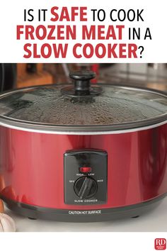 a red slow cooker with the words it's safe to cook frozen meat in a slow cooker