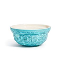 a blue bowl sitting on top of a white table