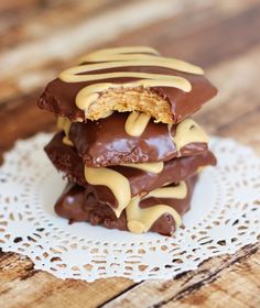 chocolate covered cookies stacked on top of each other with peanut butter drizzles