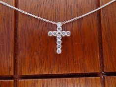 "This 18k white gold pendant is a high quality cross. This cross pendant is 19.5mm height by 13.75mm width made in 18k white gold. It has 11 quality diamonds VS2 clarity and H color range Approximately 3/4 cts total weight. The 18k white gold chain can be 16,17 or 18 inch long . This cross is made to order We love these pendant because it represents the way jewelry should be made with craftsmanship and quality. This pendent is anything but ordinary. Our pieces are designed and made with craftsma White Gold Jewelry As Gift, Aaa Quality White Gold Jewelry As Gift, Aaa Quality Diamond White Jewelry Gift, Flower Wedding Band, Men Pendant, White Diamond Rings Engagement, Gold For Women, Emerald Cut Diamond Engagement, White Gold Chain