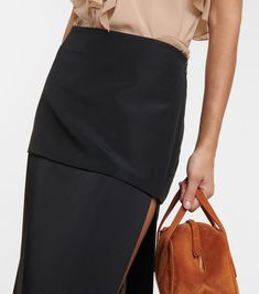 Find KHAITE Saxon Maxi Skirt on Editorialist. Material: 83% acetate, 17% viscose. Care instructions: dry clean. Made in the USA. Designer color name: Black. Lining: 100% silk. Material II: 59% viscose, 41% wool. Closure: zipped side. Flowy Asymmetrical Evening Mini Skirt, Modern Long Skirt For Office, Chic Formal Long Pencil Skirt, Chic Long Pencil Skirt For Formal Occasions, Chic Evening Pencil Skirt, Modern Black Pencil Skirt For Evening, Modern Asymmetrical Skirt For Evening, Modern Midi Skirt For Evening, Sleek Formal Asymmetrical Skirt