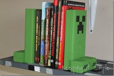 there is a green book stand with books on it