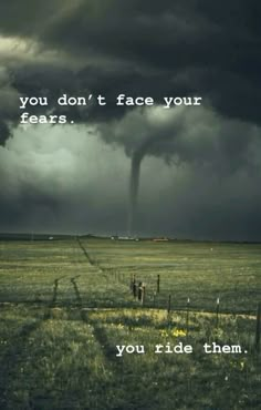 a tornado cloud is in the sky over a field