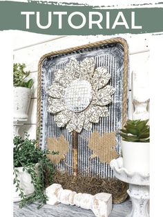 a white shelf topped with potted plants next to a metal tray covered in burlap