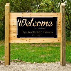 a welcome sign in front of some trees