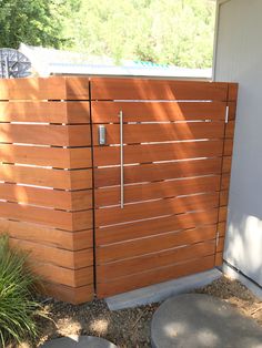 a wooden fence next to a building