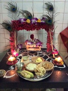 a table topped with lots of food and candles