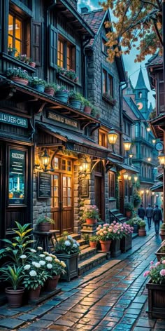 a cobblestone street lined with potted plants and flowers at dusk in an old european town