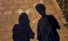 the shadow of two people with bunny ears